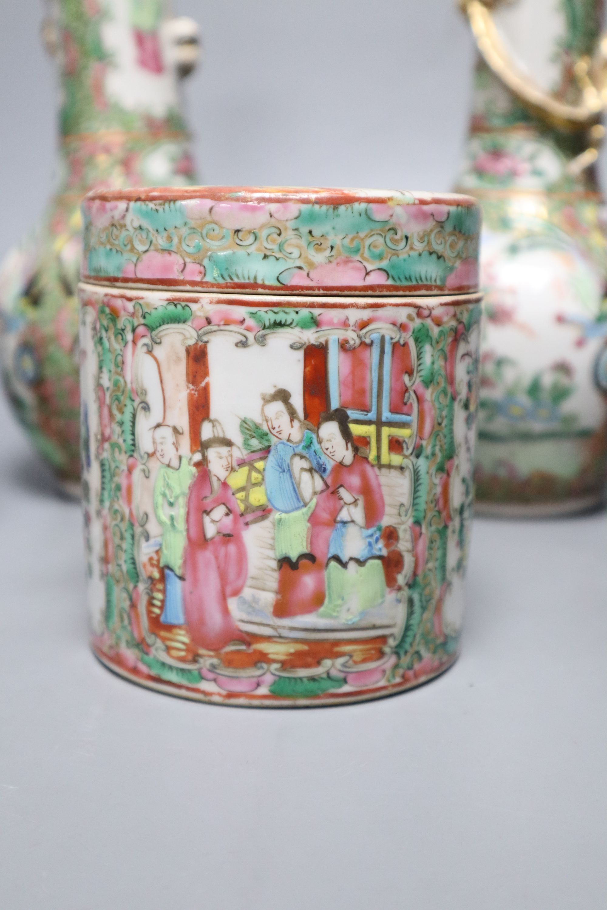 A pair of Chinese famille rose bottle vases, a similar teapot, vase and jar, 19th century, tallest 25cm